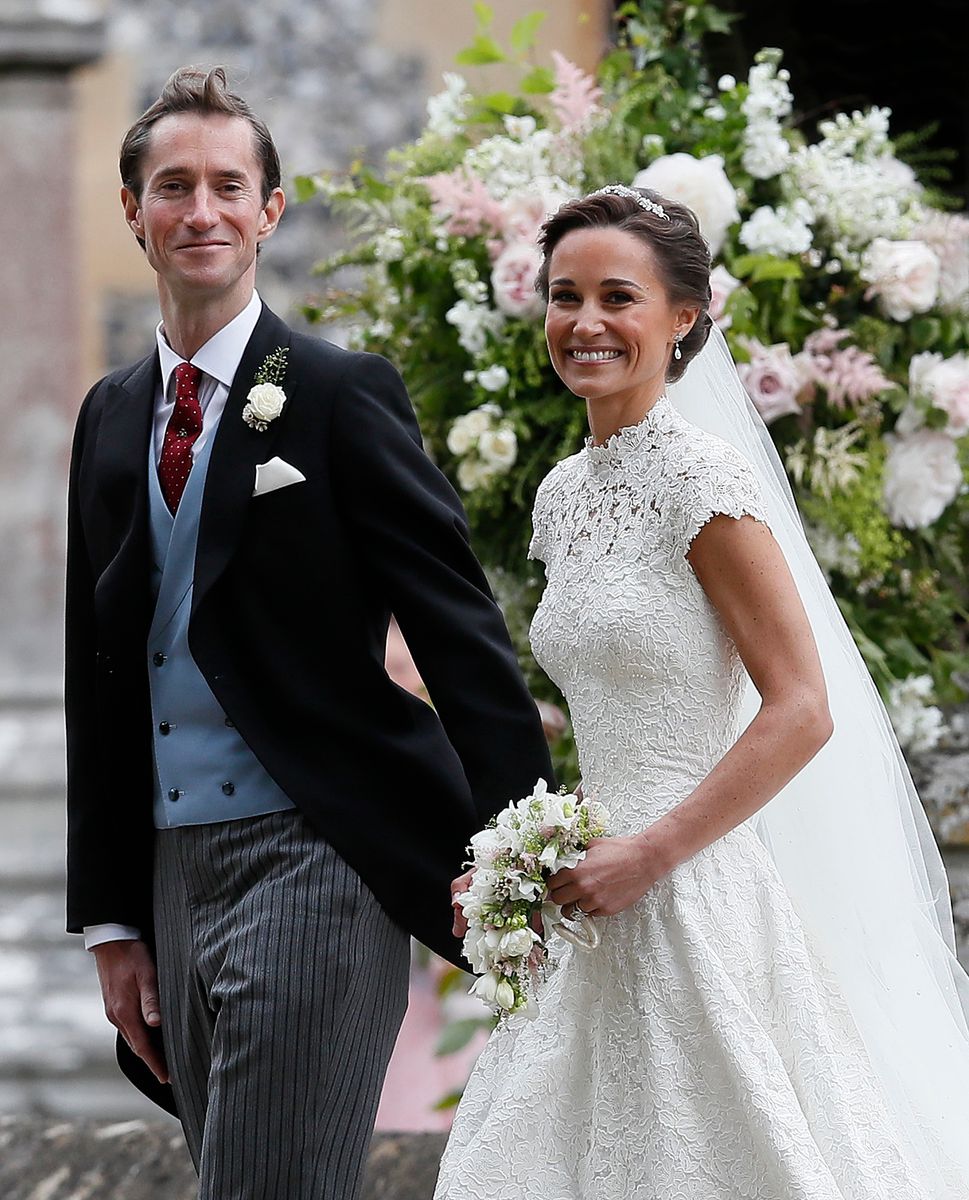 Pippa Middleton and James Matthews smile for the cameras after their wedding at St Mark's Church on May 20, 2017 in Englefield, England