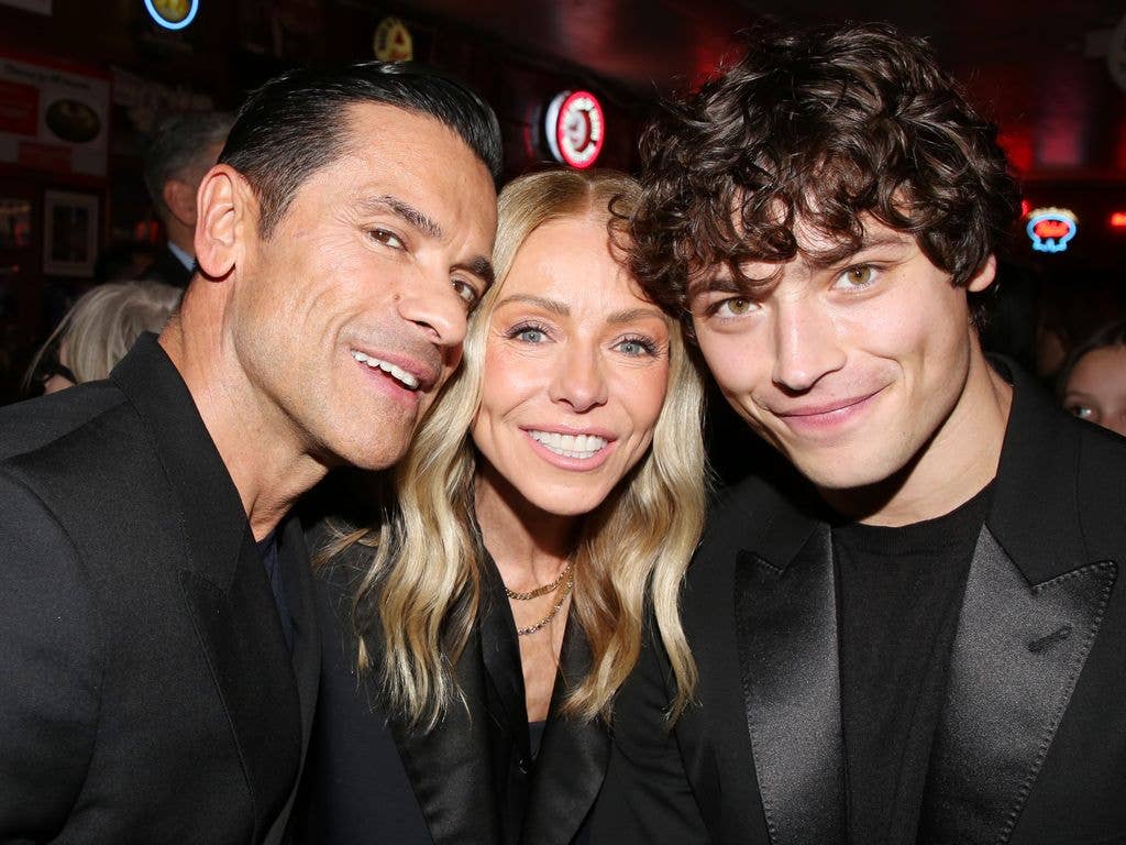 Mark Consuelos, Kelly Ripa and Joaquin Consuelos pose at the opening night after party for the new revival of Arthur Miller's "Death of a Salesman" on Broadway at Katz's Deli on April 9, 2026 in New York City.