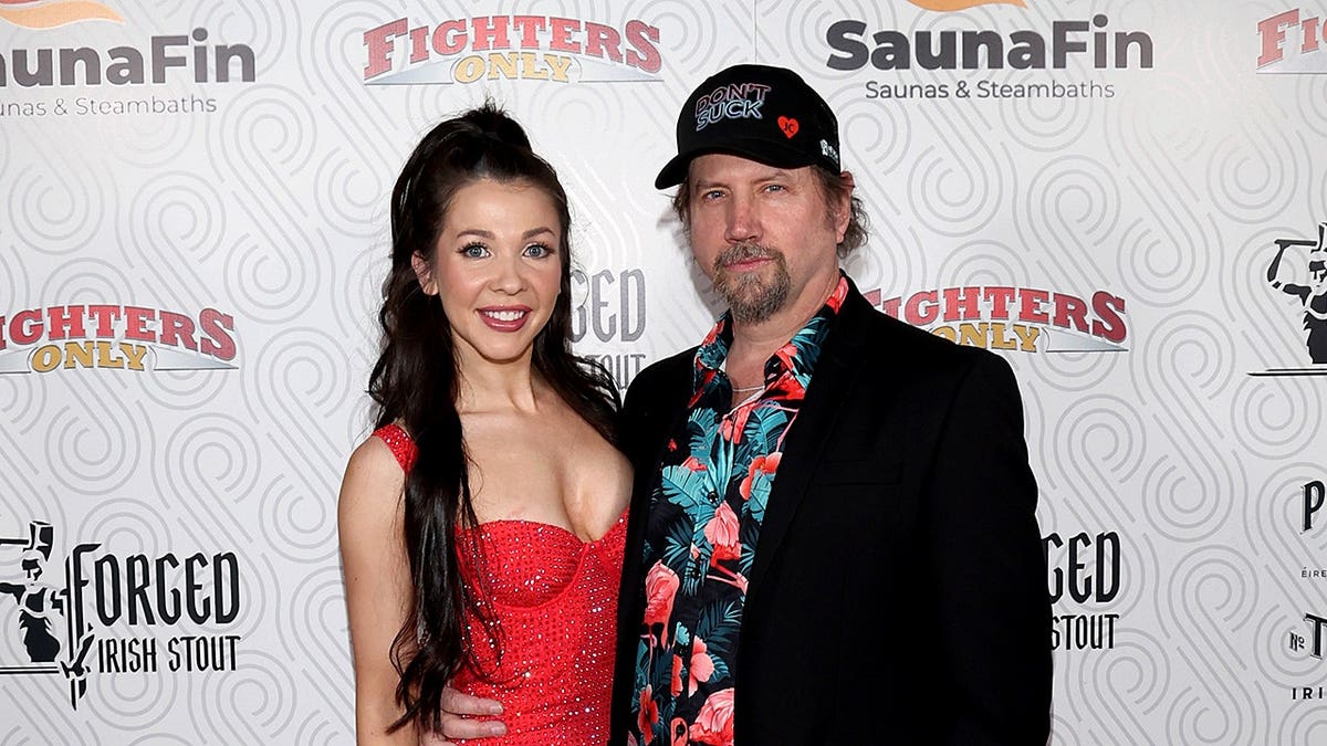 Elyssa Mai and Jamie Kennedy posing on the red carpet at the Fighters Only World Mixed Martial Arts Awards