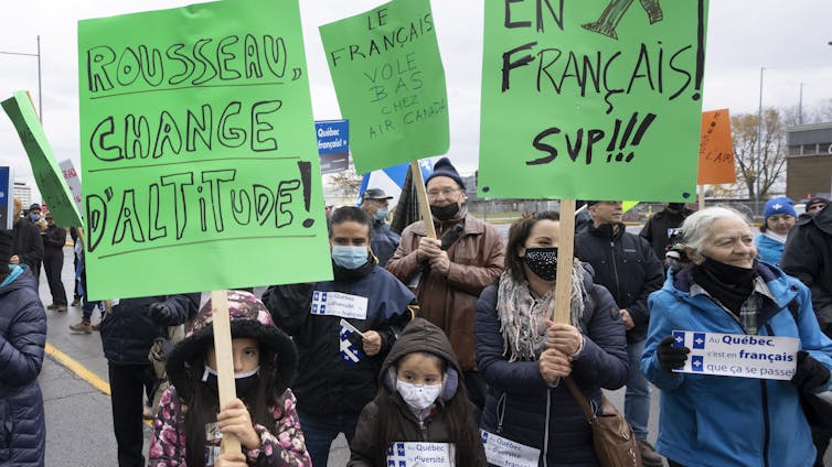 People protesting with placards in hand