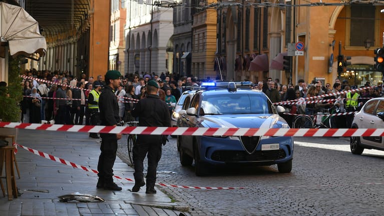 Financial Police patrol a scene after a car incident in a street of Modena, Italy, Saturday, May 16, 2026.