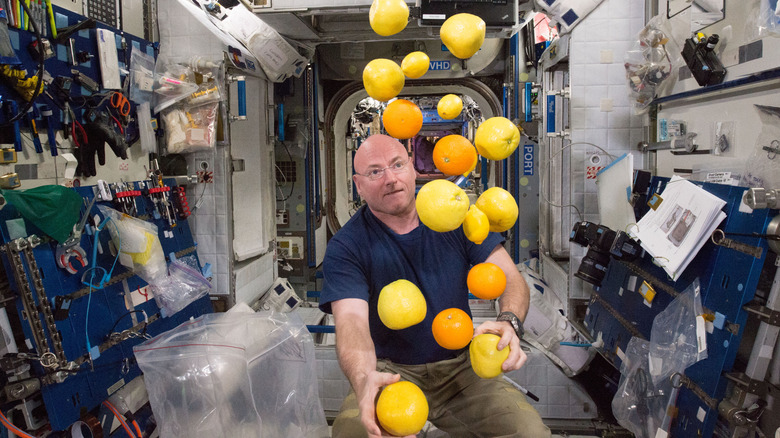 NASA astronaut Scott Kelly juggles fruit in microgravity on the International Space Station