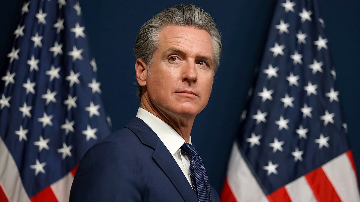 California Gov. Gavin Newsom looking on during a bill signing event in Sacramento
