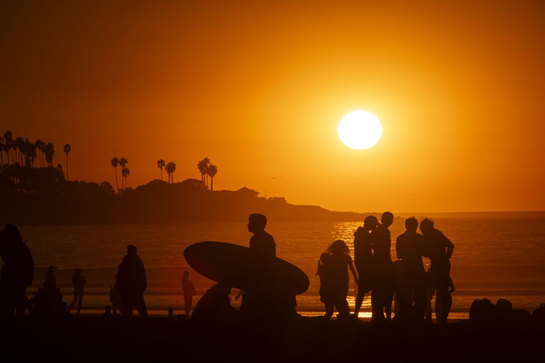 Smoke from last year's fires in Los Angeles hung in the air at La Jolla Shores beach in San Diego in January 2025. One LA business owner saw a sharp decline in visitors, compounded by misperceptions about the devastating fires.