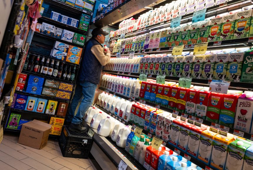 A worker stacks groceries at a store in Brooklyn on May 12, 2026, in New York City. The Labor Department's consumer price index showed that inflation rose 3.8% from April 2025.