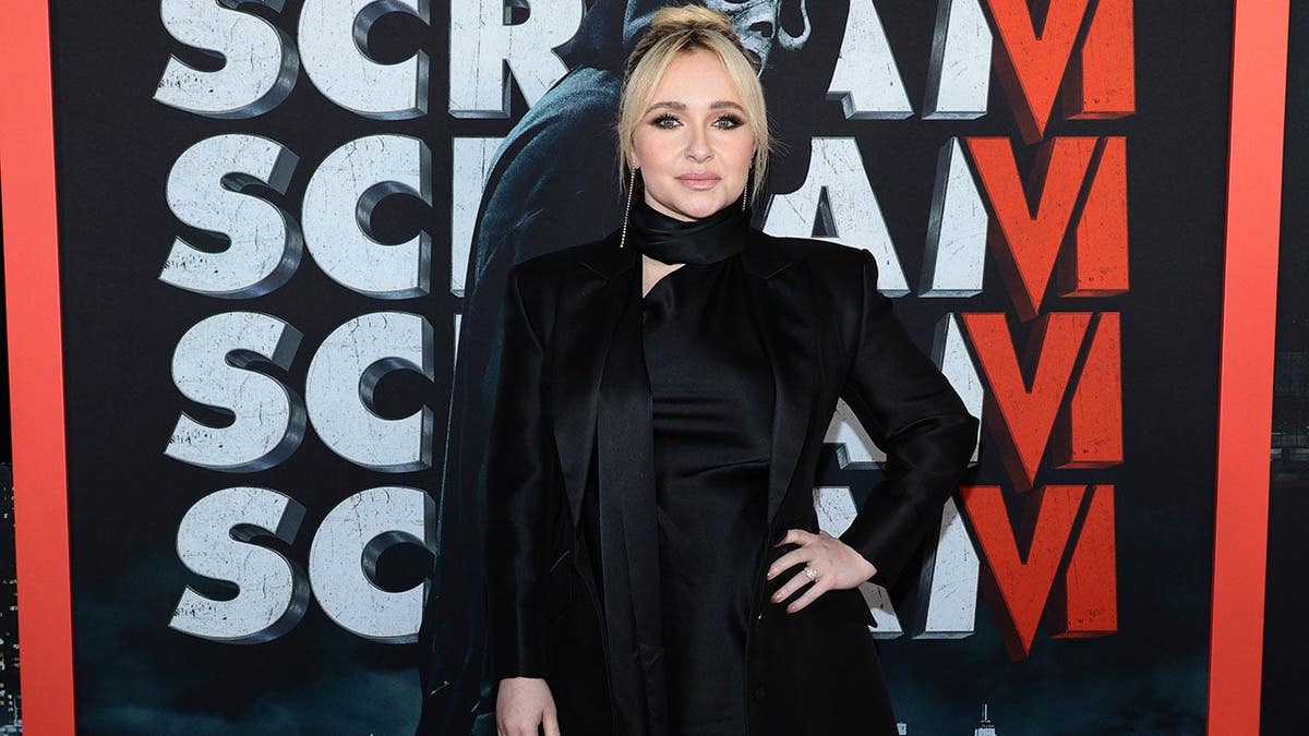 Hayden Panettiere standing at the Scream VI world premiere in New York City