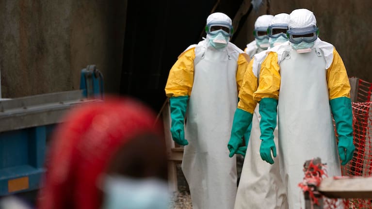 Health workers dressed in protective gear begin their shift at an Ebola treatment centre in Beni, Congo, July 16, 2019. 