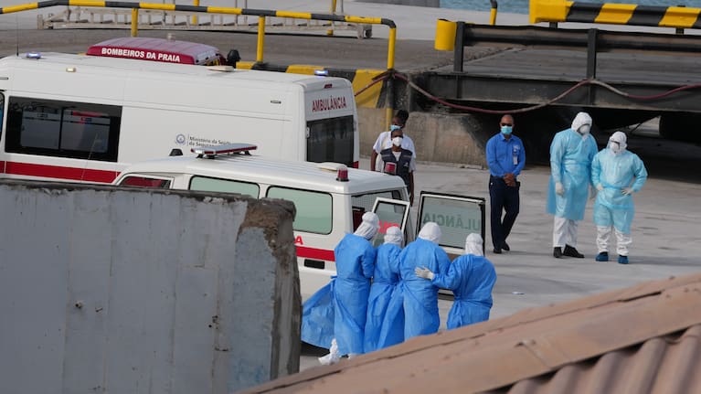 Health workers in protective gear evacuate patients from the MV Hondius cruise ship at a port in Praia, Cape Verde, Wednesday, May 6, 2026.