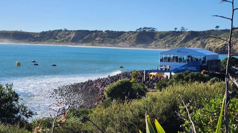 Hundreds of spectators crowded the shoreline of Manu Bay, Raglan, to watch the New Zealand Surfing Championships on 17 May 2026.