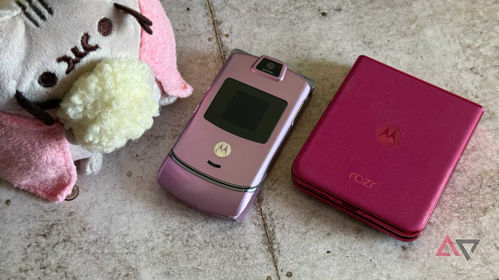 Motorola Razr+ 2024 sitting next to an older Moto Razr V3