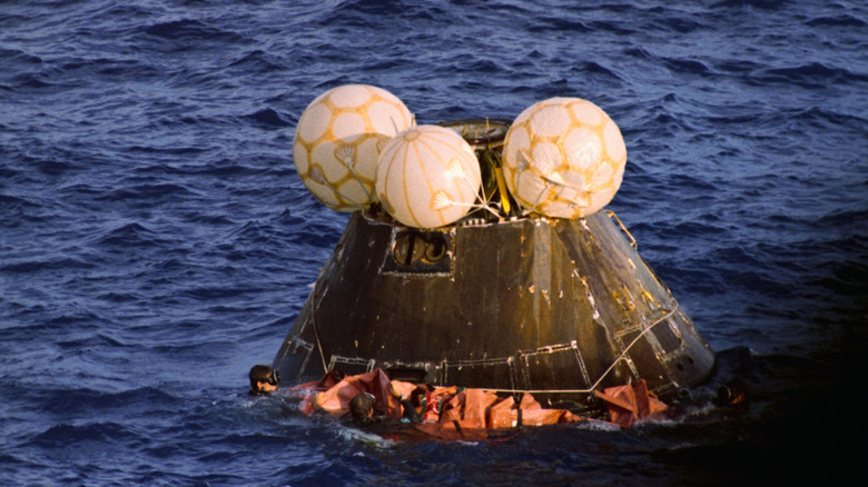 The Apollo 13 capsule floating in the Pacific Ocean after splashdown
