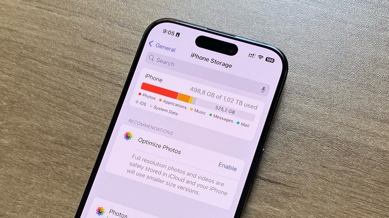 An iPhone on a desk office showing its total storage capacity