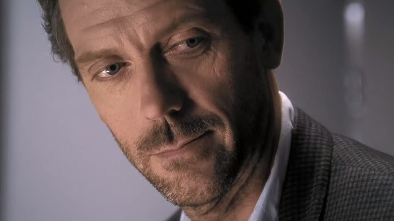 Hugh Laurie as Gregory House looking to the side
