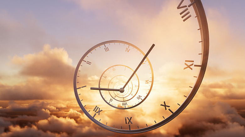 concept of time looping backwards through the clouds, clock hands visible around revolving clock face