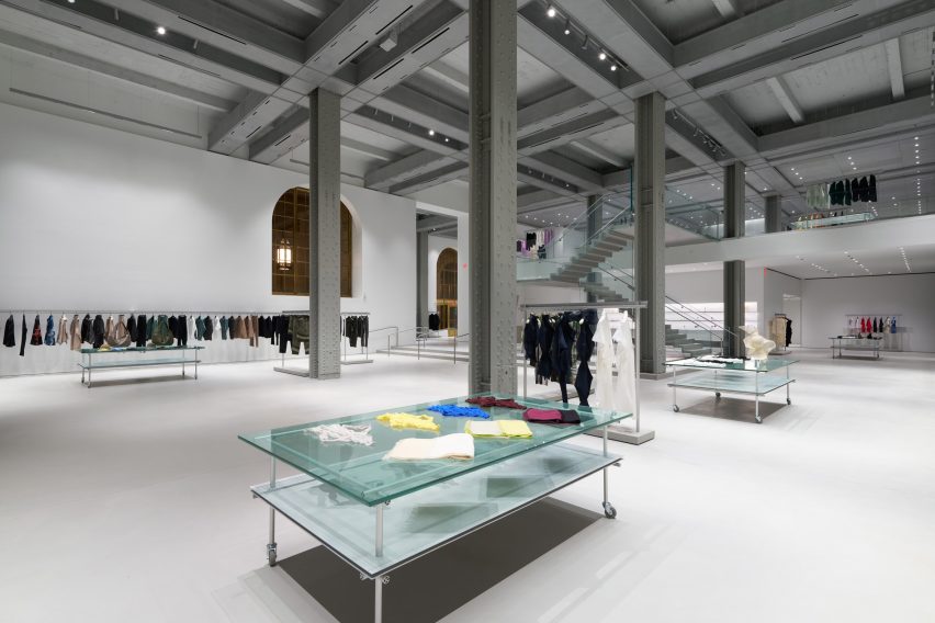 Huge studded-steel columns create symmetry and rhythm within a cavernous space