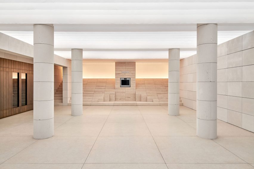 Stepped stone seating and a built-in oven form the centrepiece of Gaggenau's Presence installation