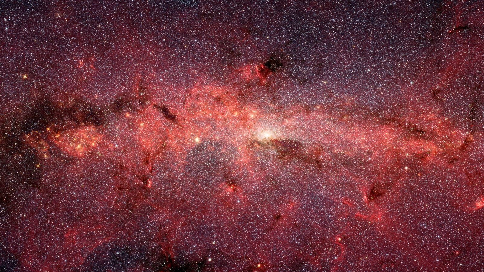 Clouds of red and purple sit on a dark background