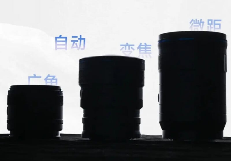Three camera lenses of varying sizes are silhouetted against a light background with faint blue Chinese characters above them. The lenses are arranged from shortest to tallest, left to right.