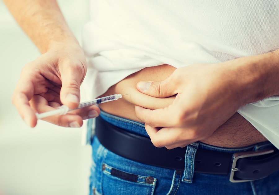 man with syringe making insulin injection 2026 03 25 10 50 16 utc