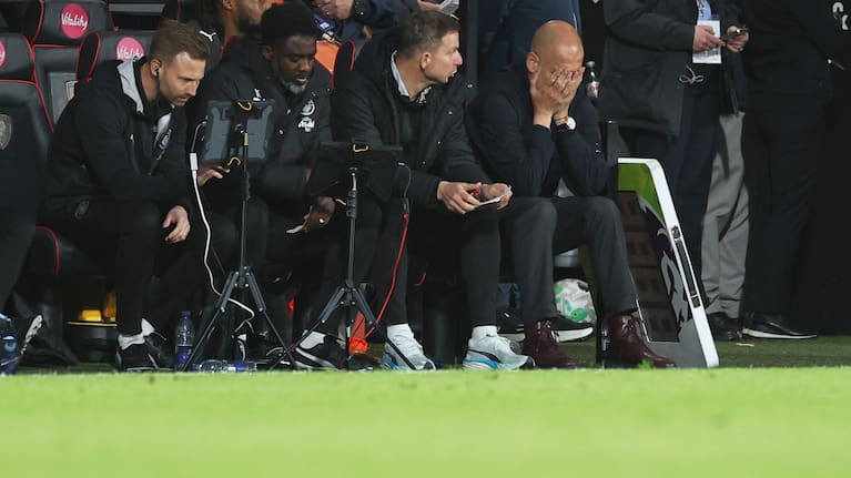 Manchester City's head coach Pep Guardiola, right, reacts during the English Premier League soccer match between AFC Bournemouth and Manchester City in Bournemouth, England, May 19, 2026. 
