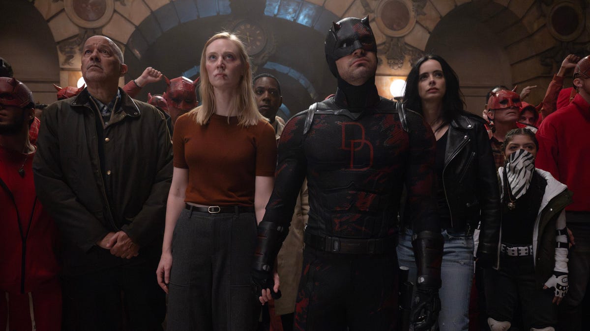 Cherry, Karen Page, Brett Mahoney, Matt Murdock/Daredevil, Jessica Jones and Angela Del Toro look upword at balcony in Daredevil Born Again.