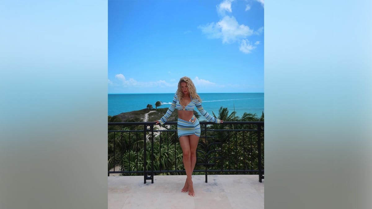 Megan Moroney in front of the ocean in a two-piece set in May 2026.