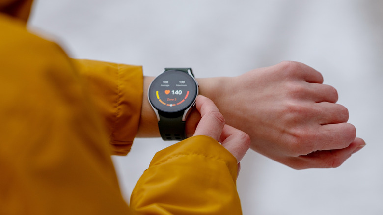 Closeup of a person using a smartwatch.
