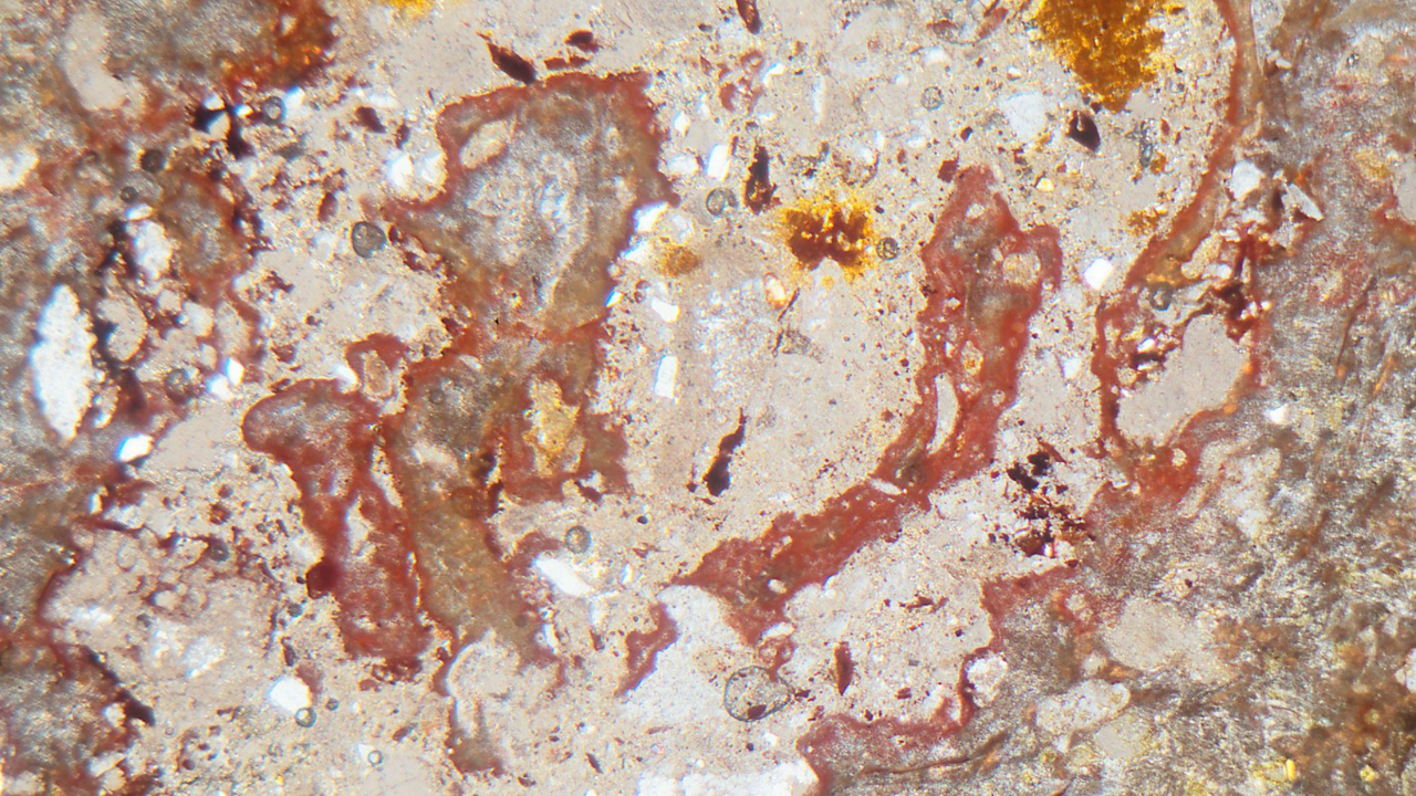 Microscopic view of suevite rock from the Ries crater near Nordlingen, formed during a giant asteroid impact around 15 million years ago. Microscopic view of suevite rock from the Ries crater near Nordlingen, formed during a giant asteroid impact around 15 million years ago.