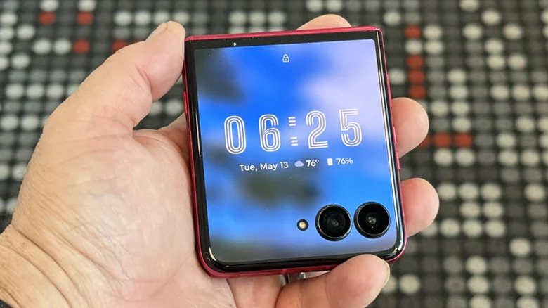 Person holding the Motorola Razr Ultra in flipped-closed configuration