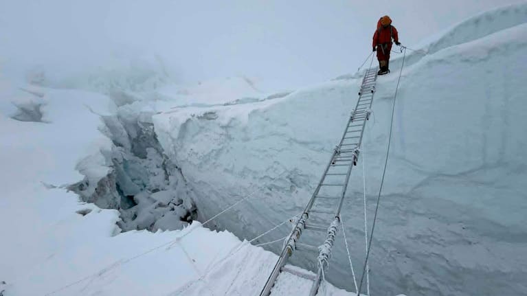 A mountaineer walks at Khumbu Icefall before beginning his ascent to the summit of Mount Everest, Nepal, in May 2026. (Source: Asian Trek via AP)