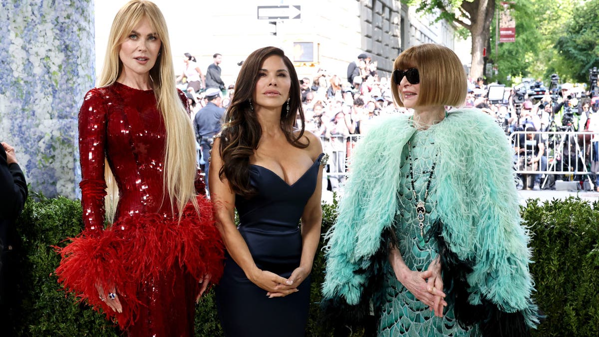 Nicole Kidman Lauren Sánchez Bezos and Anna Wintour standing together at the Met Gala in New York City