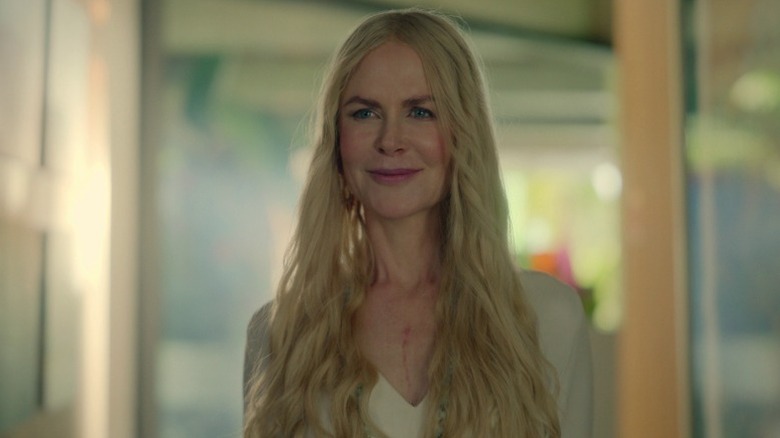 Masha (Nicole Kidman) standing at a doorway and smiling on Nine Perfect Strangers S1E1