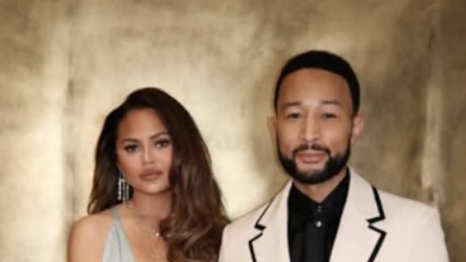 John Legend Helps Chrissy Teigen After Wardrobe Malfunction At 2026 AMAs