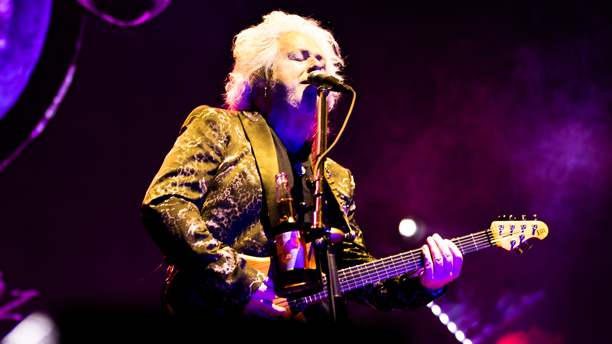 A photo of Steve Lukather performing with Toto