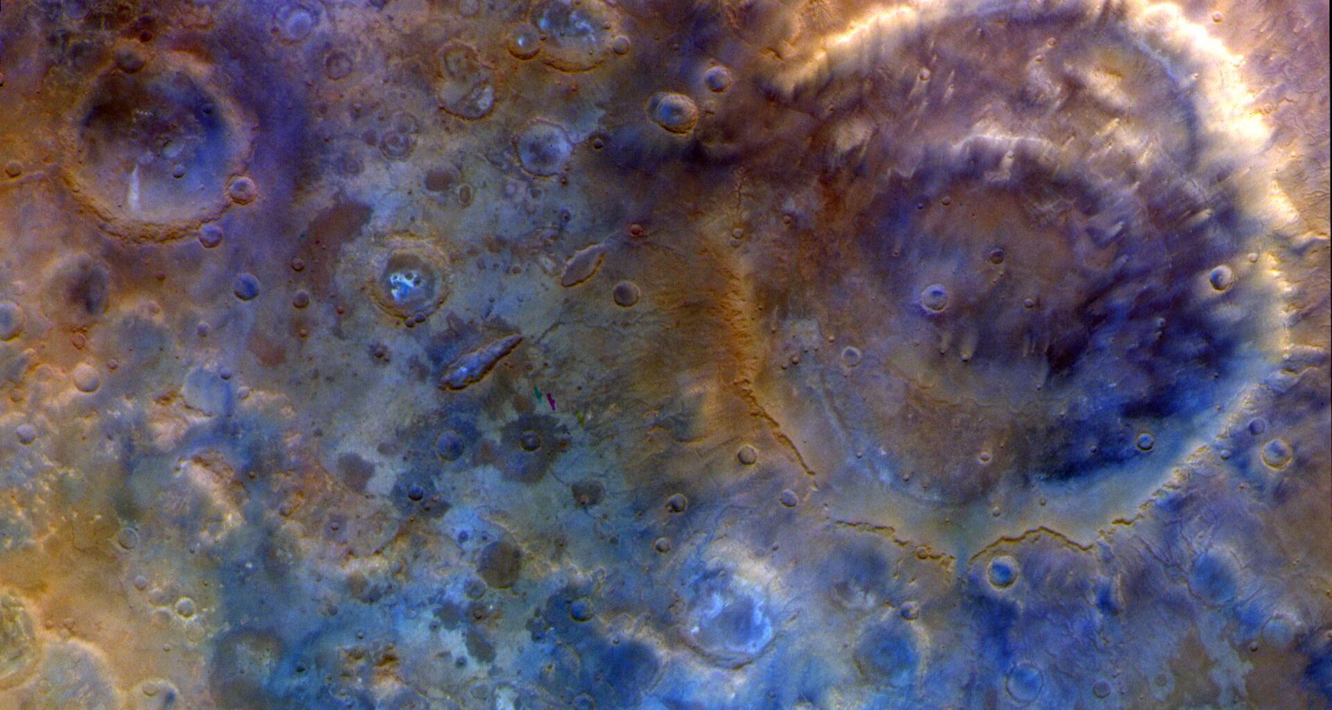 A close up of the surface of Mars, with blue and red colors.