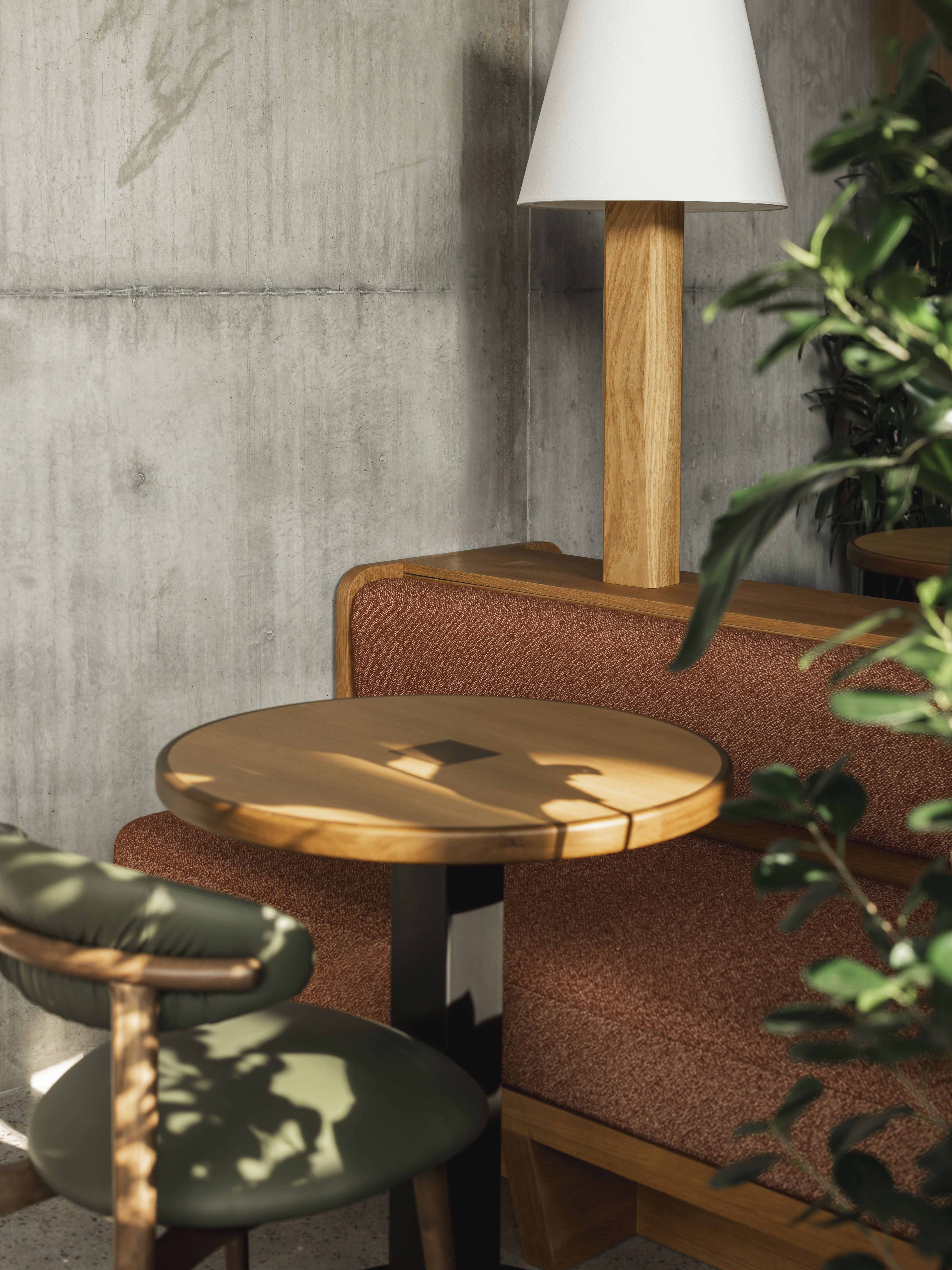 A brutalist shell of a hotel where cement walls and tall ceilings are softened by warm woods, textural fabrics, soft forms, and pendant lighting in earthy tones.