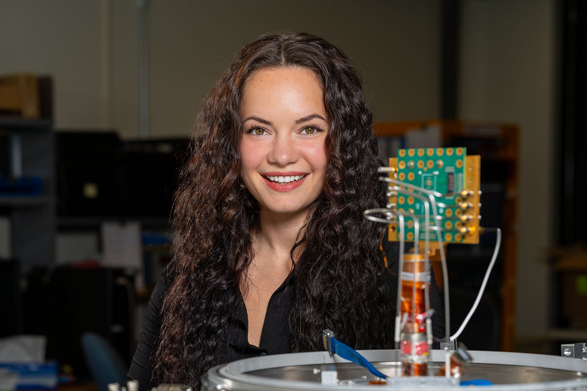 Olivia Seidel using AI to study how transistors behave in extreme cold. Credit: JJ Starr, Fermilab