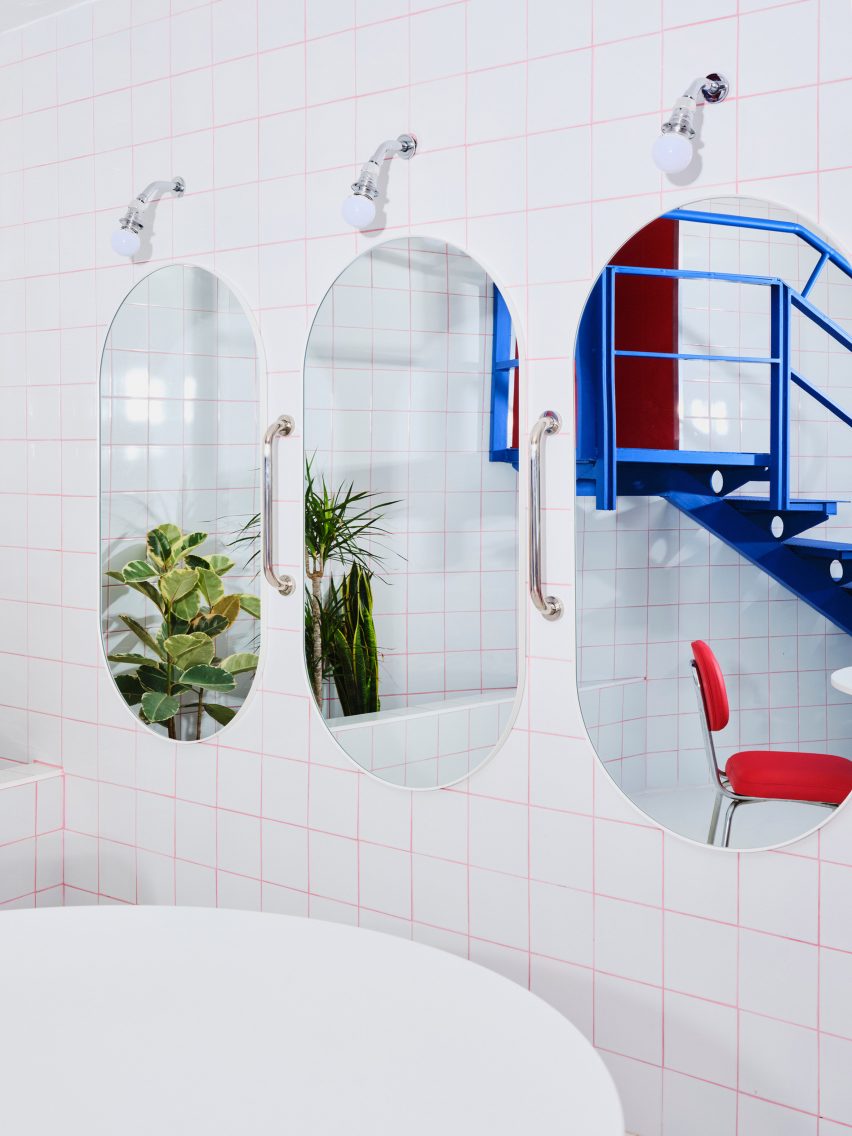 Mirrors in front of tiled wall