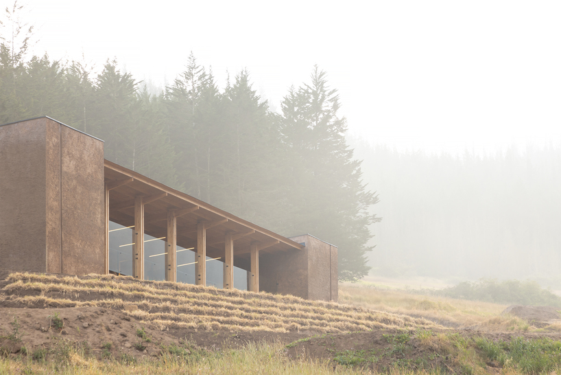 earth-toned concrete bike refuge emerges from ecuador’s reforested landscape - 3