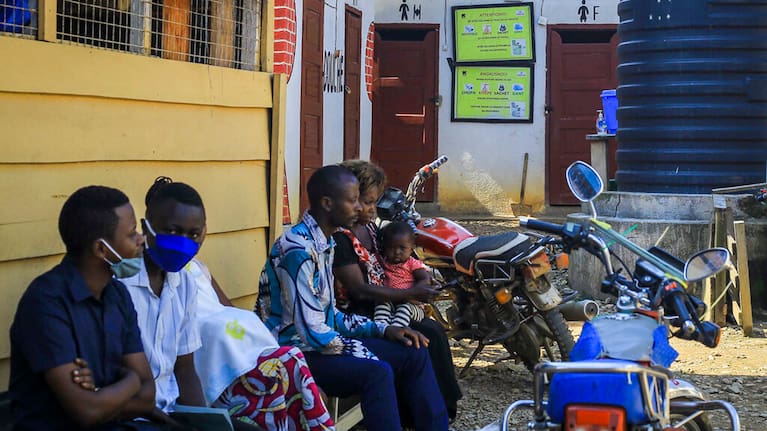 Patients wait outside to be treated at the Butsili health centre in Beni, eastern Congo on Saturday, October 9, 2021.