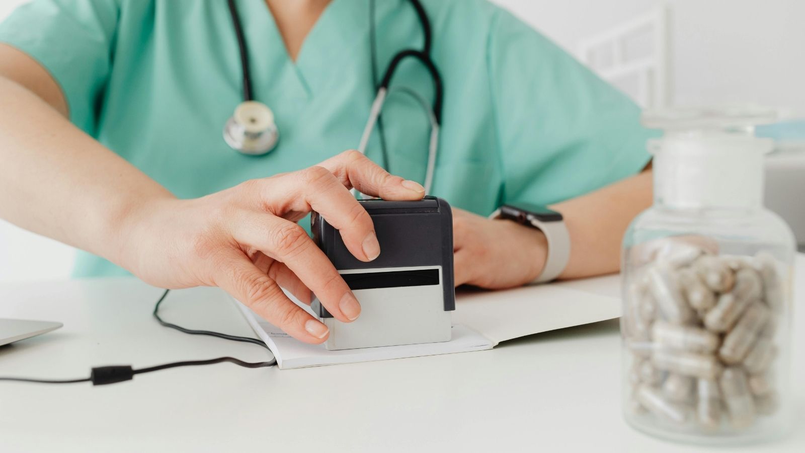 pharmacist marking a prescription
