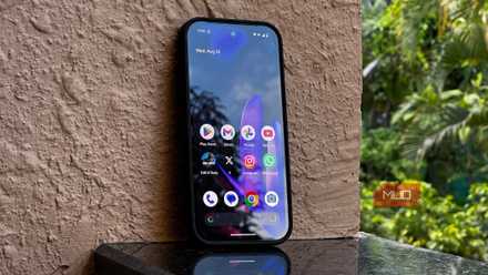 Google Pixel 9 resting against a wall showcasing its display