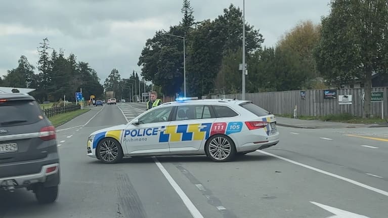 Police divert traffic near the scene of a double-fatal crash in Selwyn.