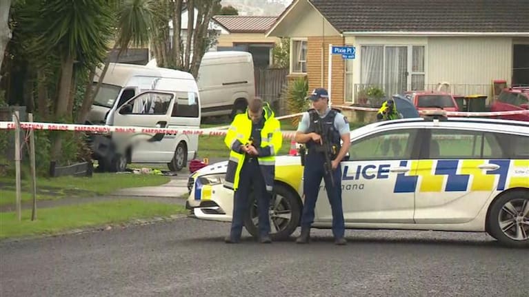 Police stand guard at the scene of a fatal shooting in Auckland's Pakuranga 