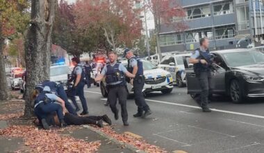 Police pull pair from car in dramatic central Auckland arrests
