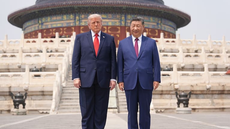President Donald Trump, left, stands with Chinese President Xi Jinping at the Temple of Heaven on Thursday May 14, 2026, in Beijing. 