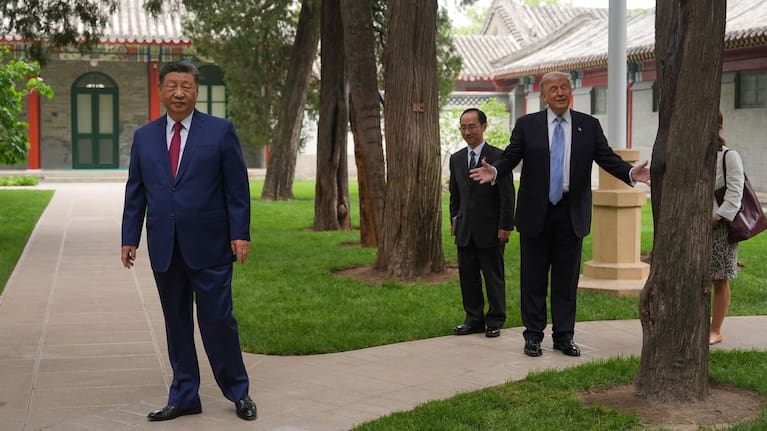President Donald Trump walks with China's President Xi Jinping at the Zhongnanhai leadership compound, Friday, May 15, 2026, in Beijing.