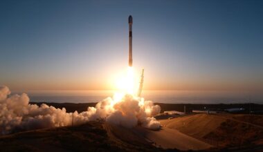 A rocket appears in silhoutte as it lifts off for space backdropped by the setting sun.