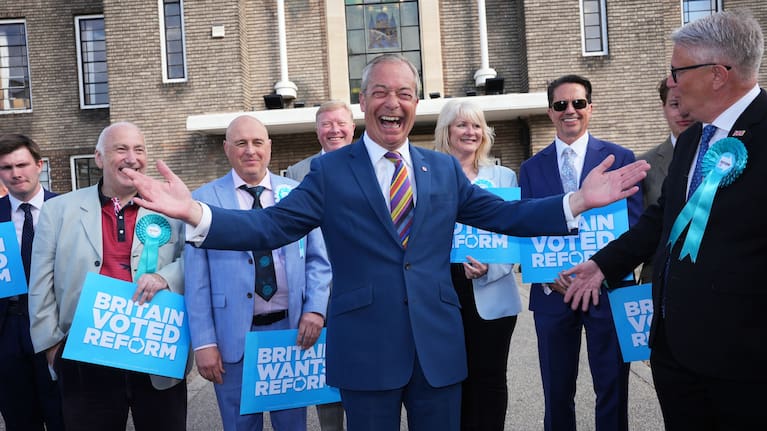 Reform UK leader Nigel Farage poses for a photo during a visit to Havering Town Hall, in Romford, England.