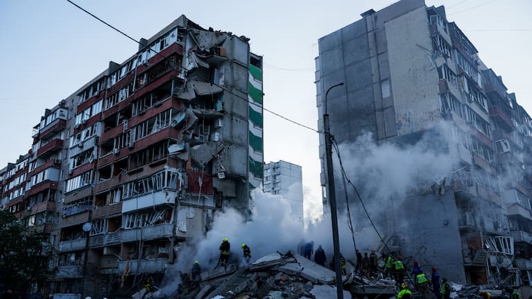 Rescue workers clear the rubble of a house heavily damaged after a Russian strike on a residential neighborhood in Kyiv, Ukraine.
